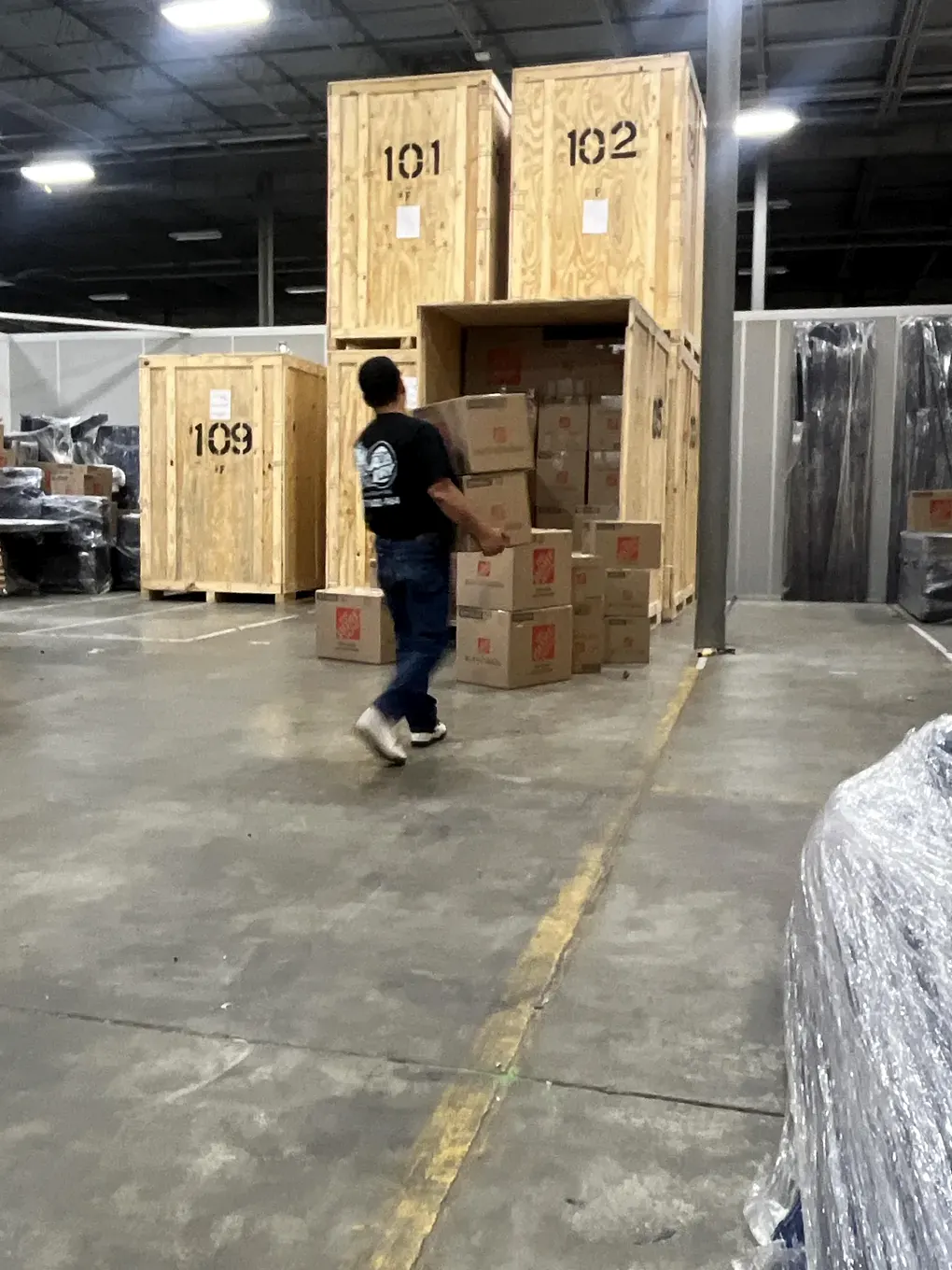 All Dry crew member loading packed contents into a secure storage vault