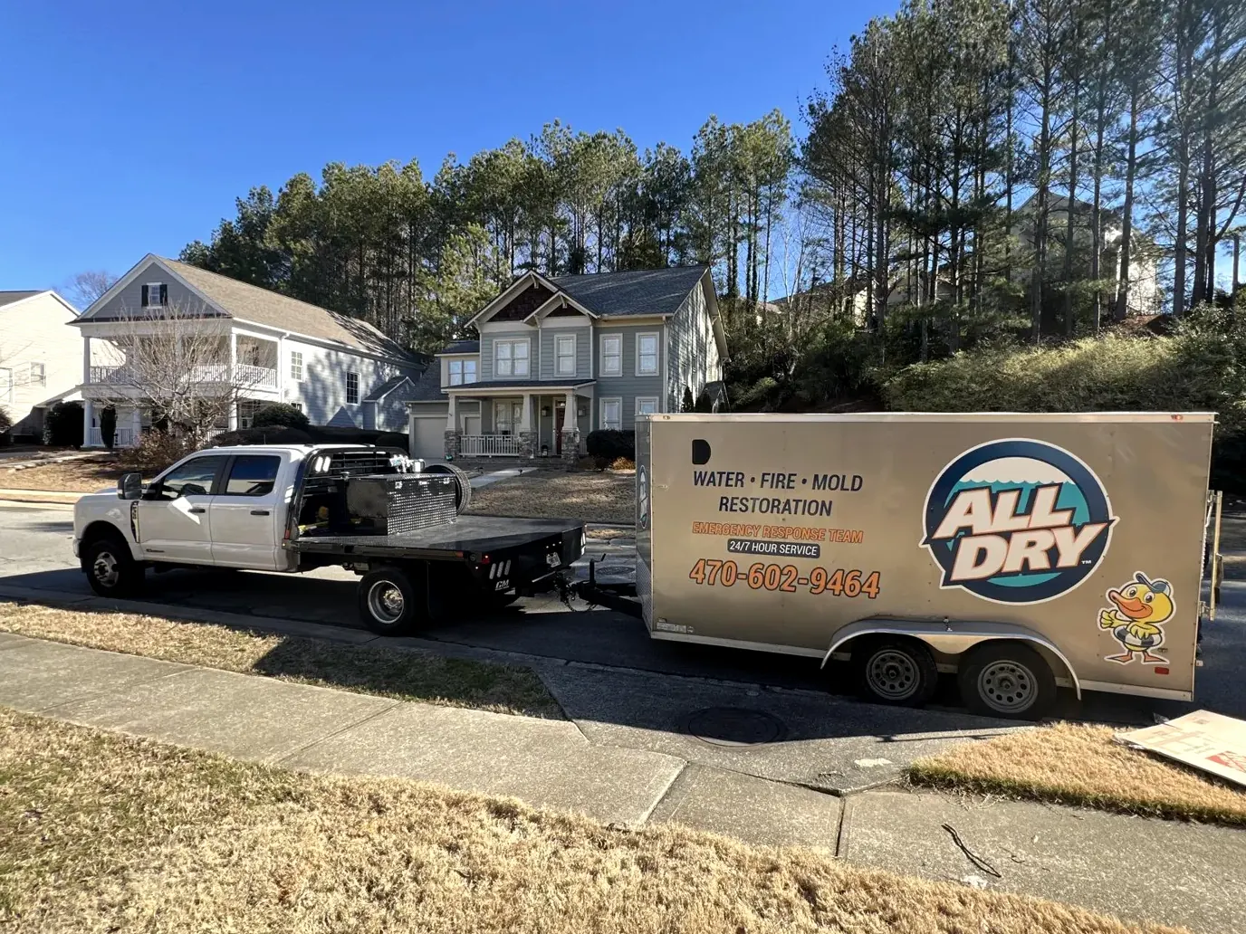 All Dry Services truck and branded trailer on a job site in metro Atlanta