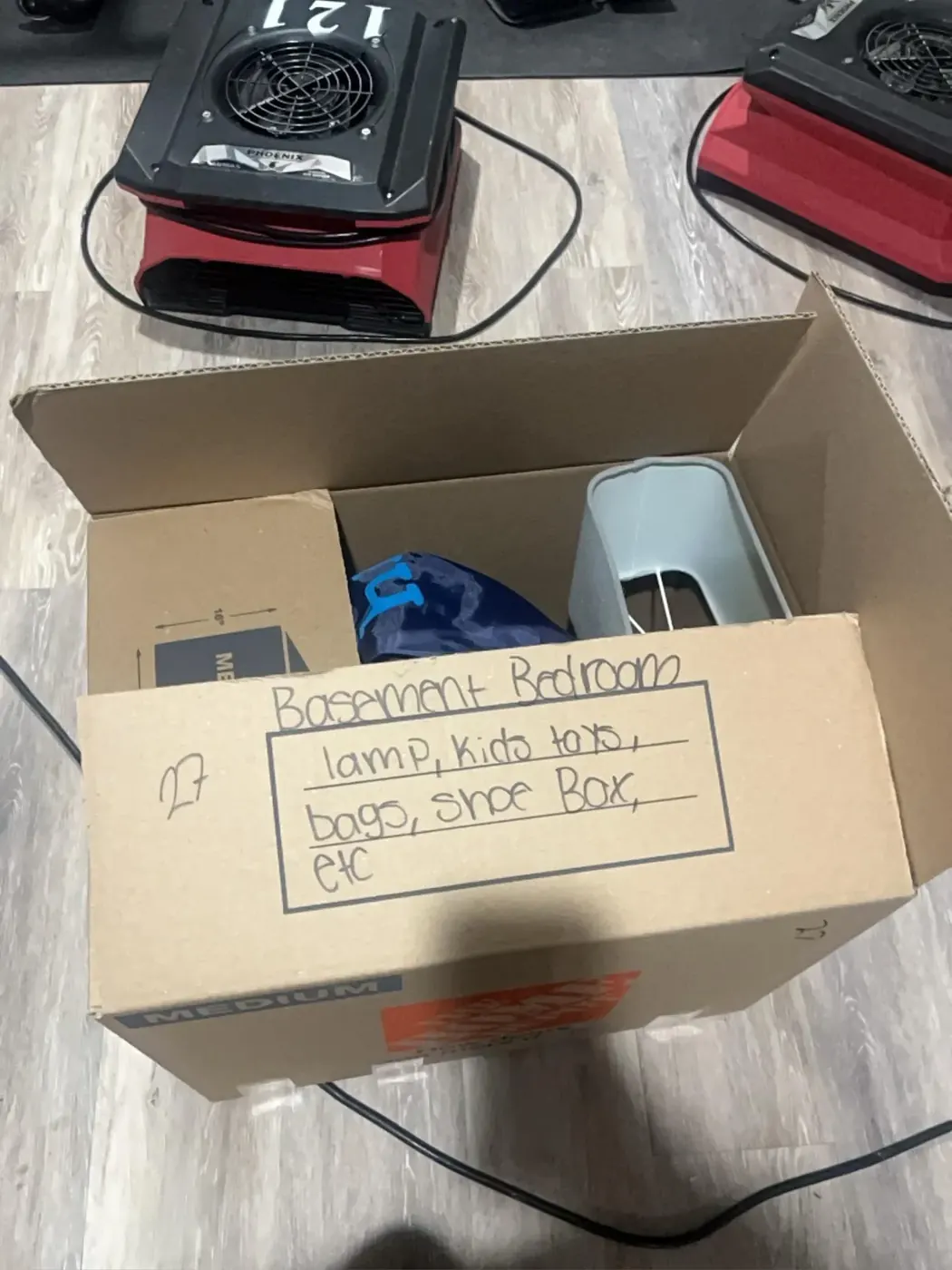 Pack-out box labeled by room and contents for the insurance inventory