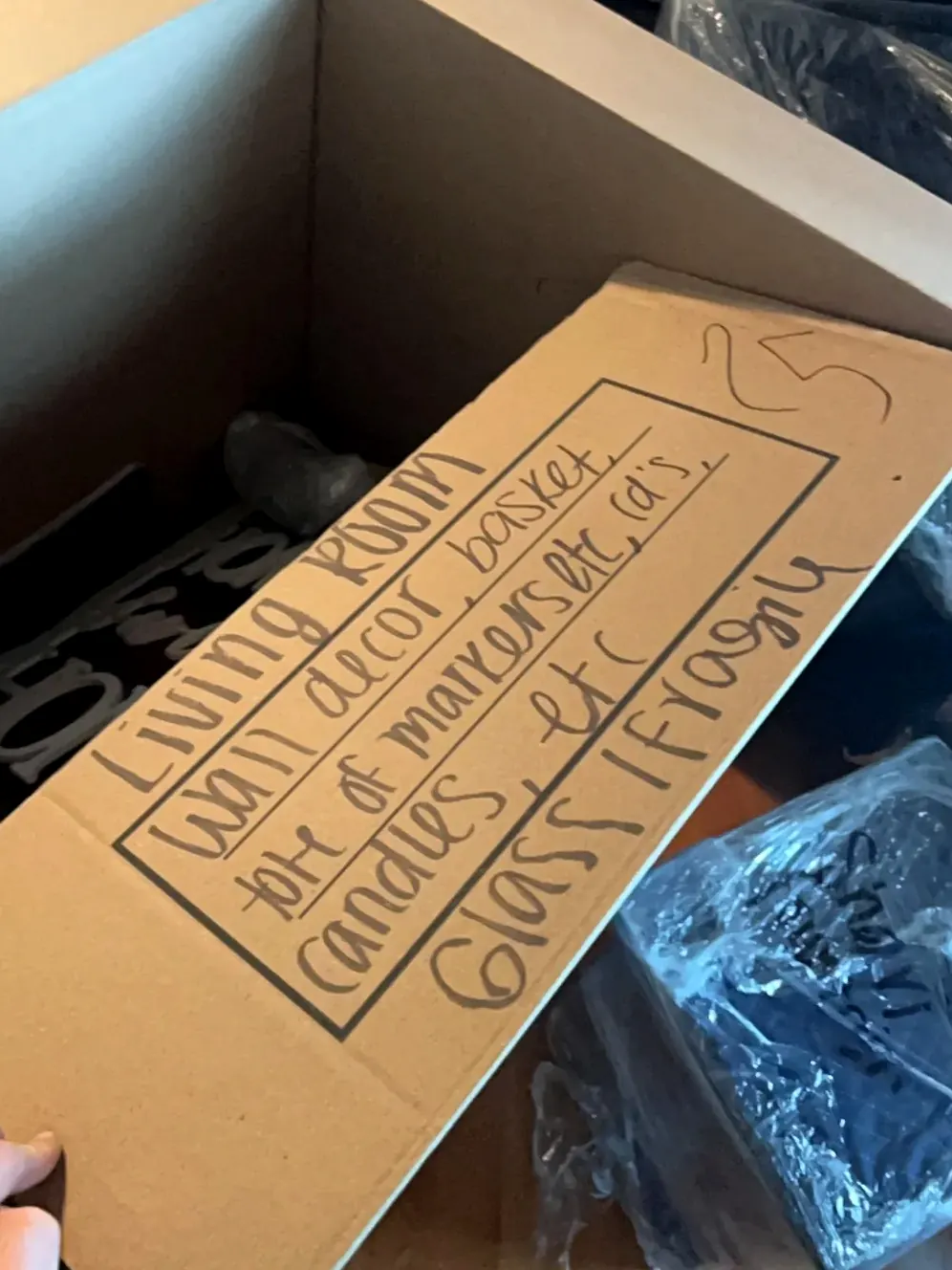 Living room contents boxed and labeled during fire damage pack-out