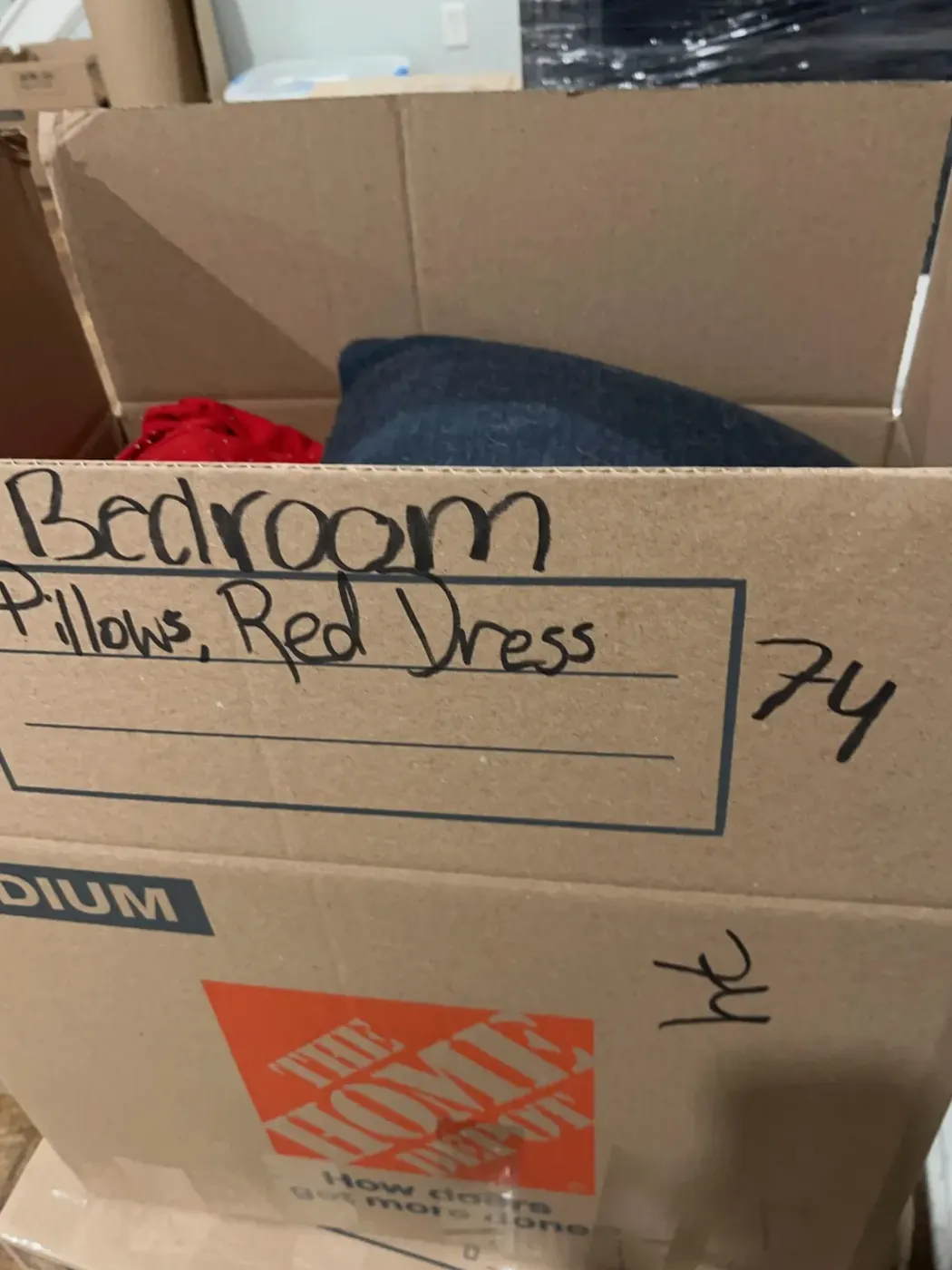 Pack-out box labeled by room and contents for the insurance inventory