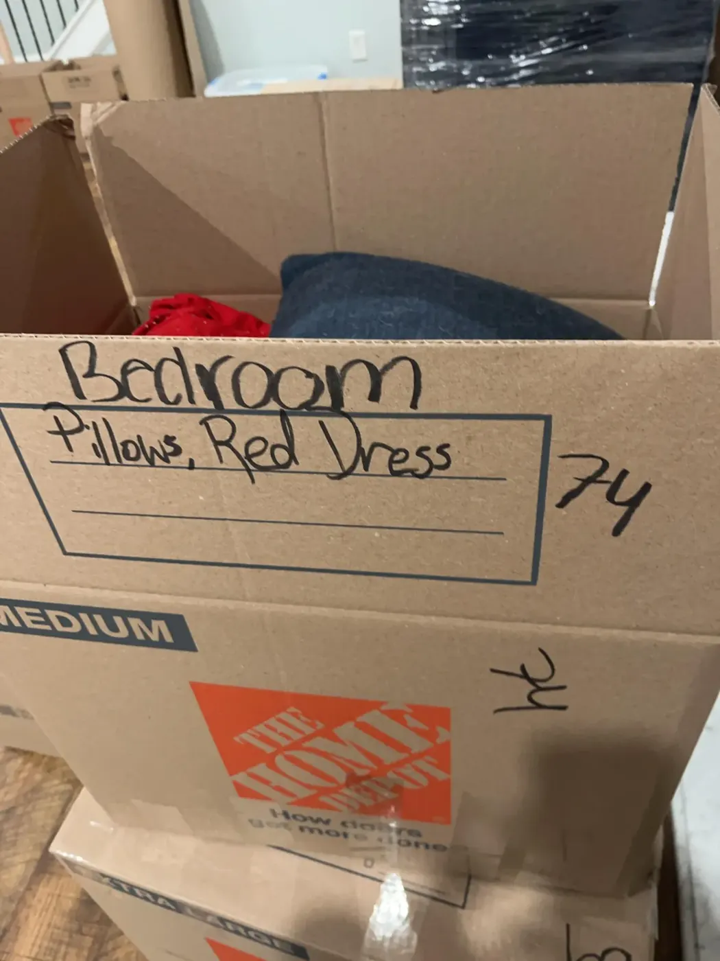 Pack-out box labeled with the room and items inside