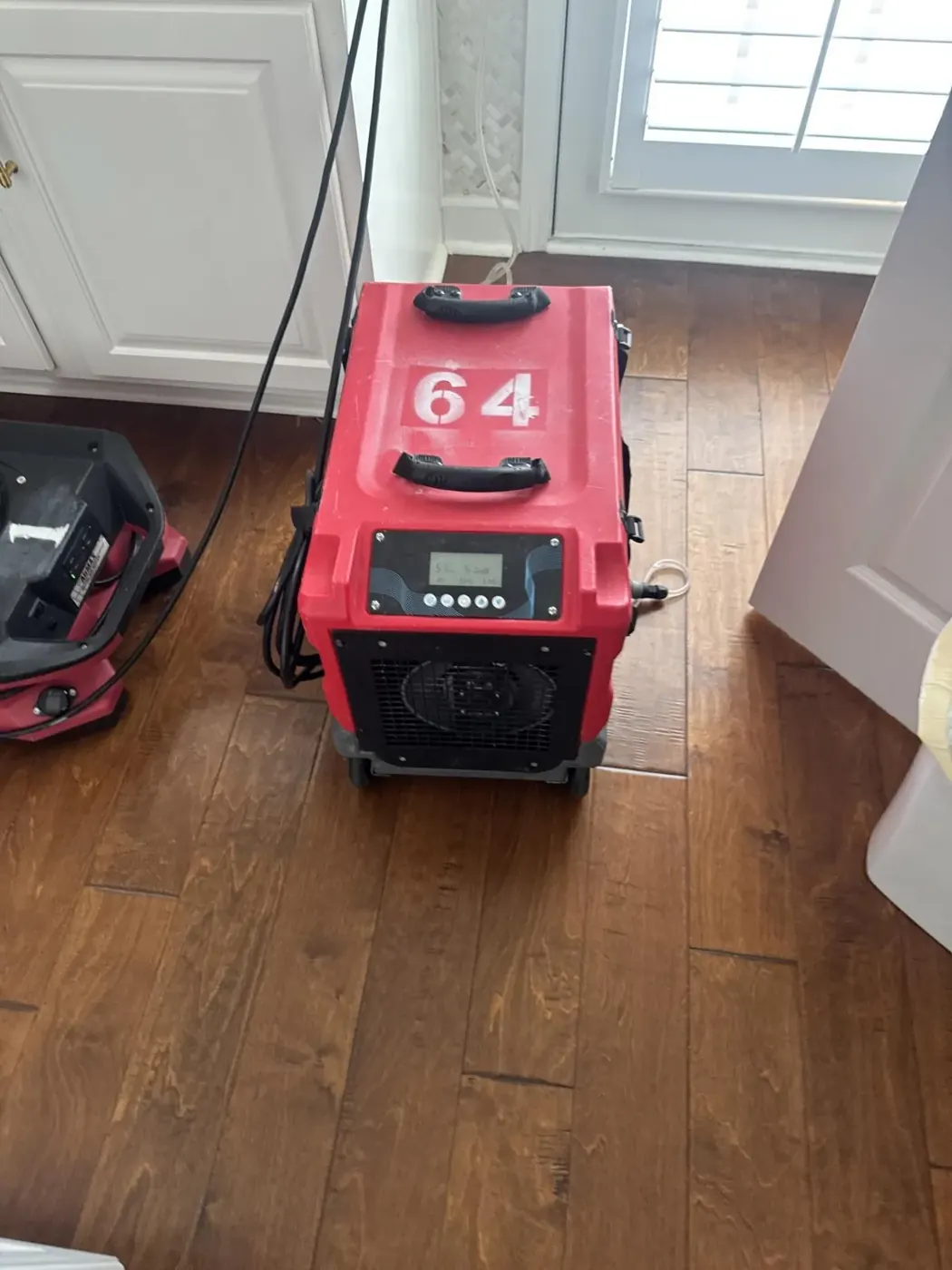 LGR dehumidifier drying hardwood floors in Suwanee, GA