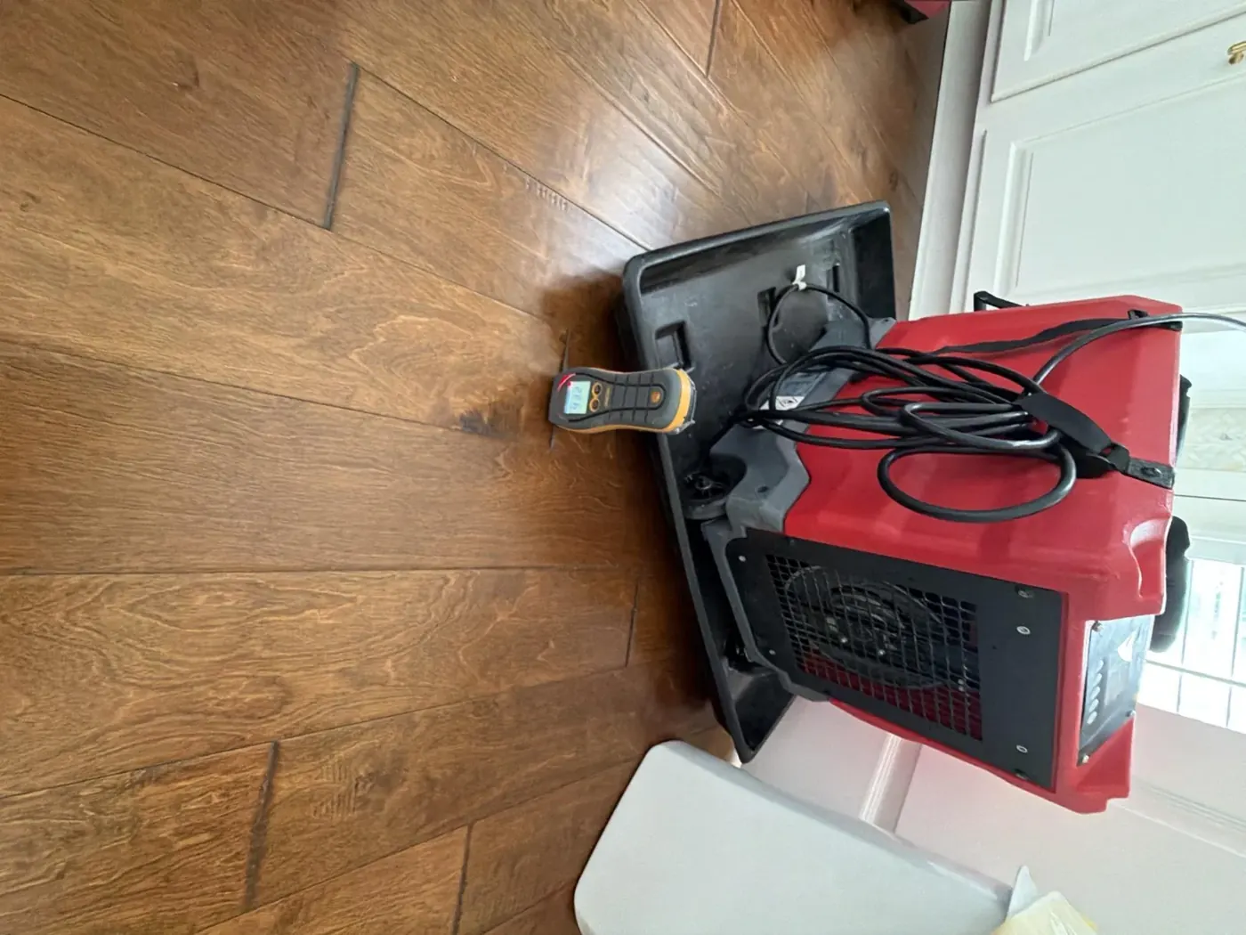 Dehumidifier and air movers drying a water-damaged home in Suwanee, GA