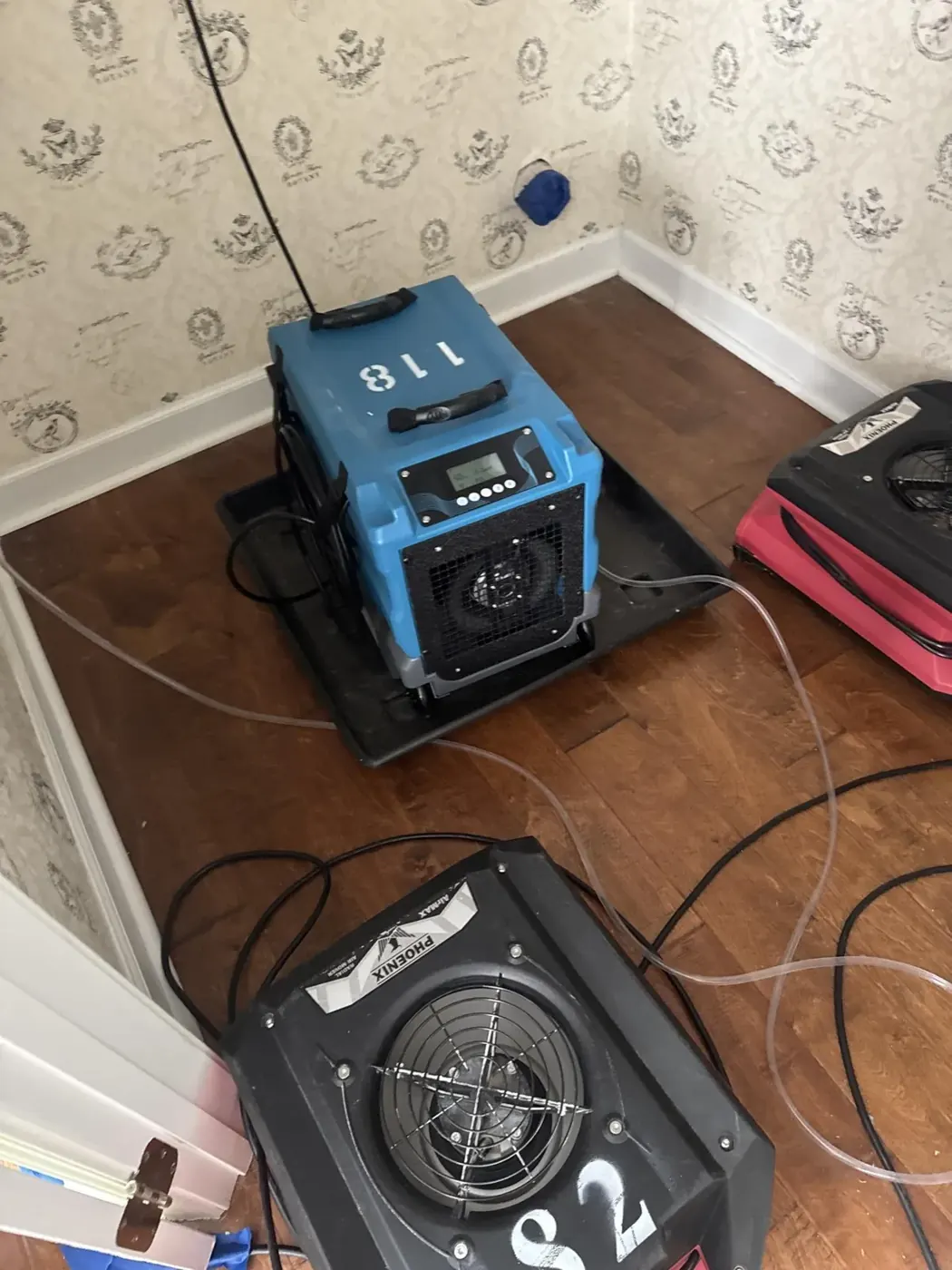 Dehumidifiers and air movers drying hardwood floors in Suwanee, GA (2)