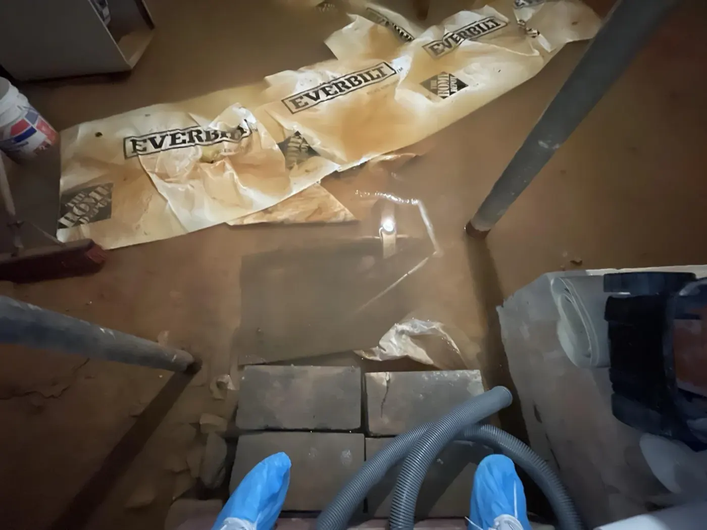 Water extraction hoses in a flooded basement in Alpharetta, GA